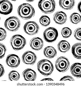 Grunge concentric circles hand drawn seamless pattern. Rings with spots ink dirty texture. Black paint brush splodges background. Abstract rough circular scribbles. Wallpaper, wrapping paper design.