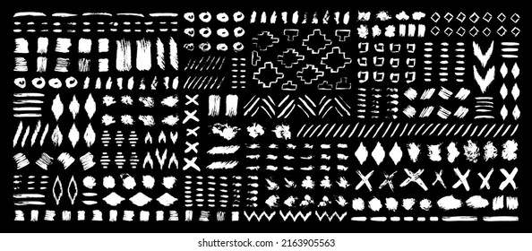Grunge design elements set. Grunge shapes collection for patterns or backdrops. Paint stains and brush strokes. Tribal ethnic style. Grungy ink spots and drops.