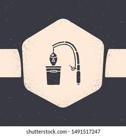 Grunge Fishing rod and fish icon isolated on grey background. Put fish into a bucket. Fishing equipment and fish farming topics. Monochrome vintage drawing. Vector Illustrationn