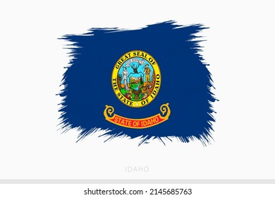 Grunge flag of Idaho, vector abstract grunge brushed flag of Idaho on gray background.