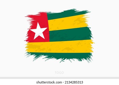 Grunge flag of Togo, vector abstract grunge brushed flag of Togo on gray background.