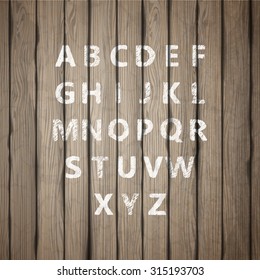 Grunge full alphabet on old wooden board. Vector
