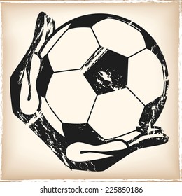 Grunge goalkeeper with gloves holding a soccer ball