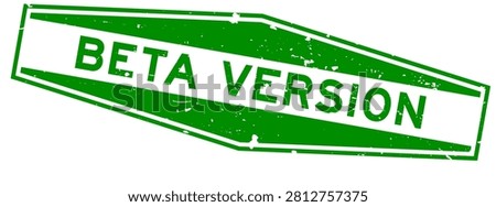 Grunge green beta version word hexagon rubber seal stamp on white background