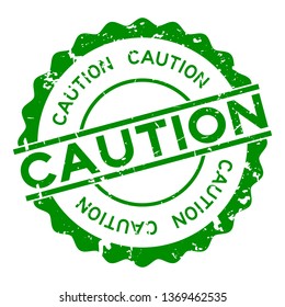 Grunge green caution word round rubber seal stamp on white background