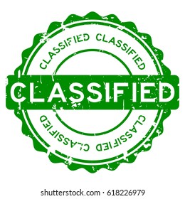 Grunge green classified round rubber stamp on white background