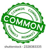 Grunge green common word round rubber seal stamp on white background