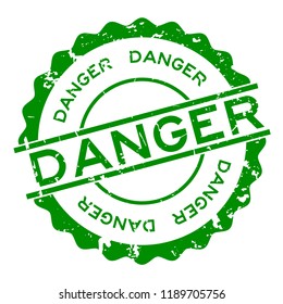 Grunge green danger word round rubber seal stamp on white background