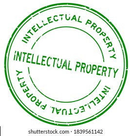Grunge green intellectual property word round rubber seal stamp on white background