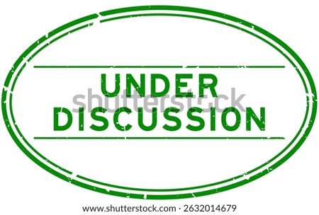 Grunge green under discussion word oval rubber seal stamp on white background