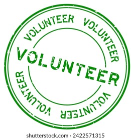 Grunge green volunteer word round rubber seal stamp on white background