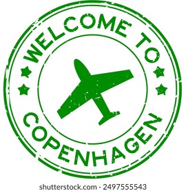 Grunge green welcome to copenhagen word with plane icon round rubber seal stamp on white background