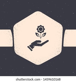 Grunge Hand holding flower icon isolated on grey background. Seed and seedling. Planting sapling. Ecology concept. Monochrome vintage drawing. Vector Illustration