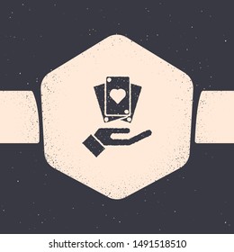 Grunge Hand holding playing cards icon isolated on grey background. Сasino game design. Monochrome vintage drawing. Vector Illustration