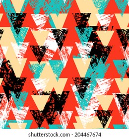Grunge hand painted abstract pattern with bold textured triangles in bright multiple colors, seamless vector.