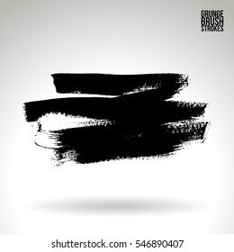 Grunge hand - painted brush stroke on a light background. Expressive vector element for design.