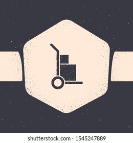 Grunge Hand truck and boxes icon isolated on grey background. Dolly symbol. Monochrome vintage drawing. Vector Illustration