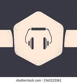 Grunge Headphones icon isolated on grey background. Earphones. Concept for listening to music, service, communication and operator. Monochrome vintage drawing. Vector Illustration