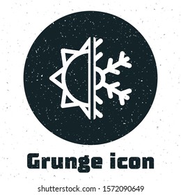 Grunge Hot and cold symbol. Sun and snowflake icon isolated on white background. Winter and summer symbol.  Vector Illustration