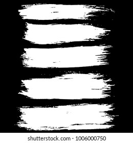Grunge ink brush strokes set. Freehand black brushes. Handdrawn dry brush black smears. Modern vector illustration.
