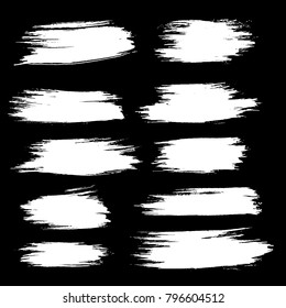 Grunge ink brush strokes set. Freehand black brushes. Handdrawn dry brush black smears. Modern vector illustration.
