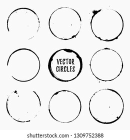 Grunge ink circles. Coffee rings and stains isolated on white background. Black vector design elements.