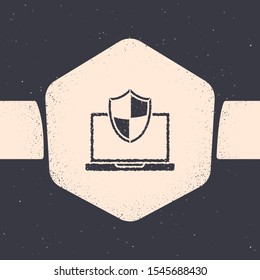 Grunge Laptop protected with shield icon isolated on grey background. PC security, firewall technology, privacy safety. Monochrome vintage drawing. Vector Illustration