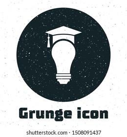 Grunge Light bulb and graduation cap icon isolated on white background. University Education concept.  Vector Illustration