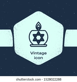 Grunge line Burning candle in candlestick with star of david icon isolated on blue background. Cylindrical candle stick with burning flame. Monochrome vintage drawing. Vector Illustration