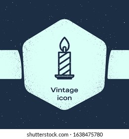 Grunge line Burning candle in candlestick icon isolated on blue background. Cylindrical candle stick with burning flame. Monochrome vintage drawing. Vector Illustration