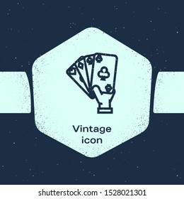 Grunge line Hand holding playing cards icon isolated on blue background. Casino game design. Monochrome vintage drawing. Vector Illustration
