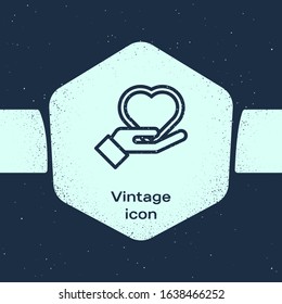Grunge line Heart on hand icon isolated on blue background. Hand giving love symbol. Valentines day symbol. Monochrome vintage drawing. Vector Illustration