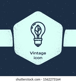 Grunge line Light bulb with leaf icon isolated on blue background. Eco energy concept. Alternative energy concept. Monochrome vintage drawing. Vector Illustration