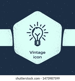Grunge line Light bulb with rays shine and concept of idea icon isolated on blue background. Energy and idea symbol. Inspiration concept. Monochrome vintage drawing. Vector Illustration