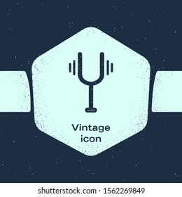 Grunge line Musical tuning fork for tuning musical instruments icon isolated on blue background. Monochrome vintage drawing. Vector Illustration