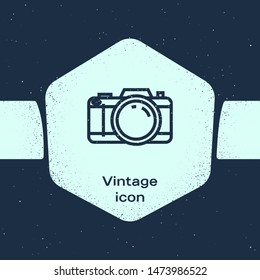 Grunge line Photo camera icon isolated on blue background. Foto camera icon. Monochrome vintage drawing. Vector Illustration