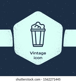 Grunge line Popcorn in cardboard box icon isolated on blue background. Popcorn bucket box. Monochrome vintage drawing. Vector Illustration