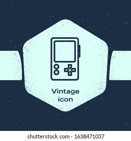 Grunge line Portable video game console icon isolated on blue background. Gamepad sign. Gaming concept. Monochrome vintage drawing. Vector Illustration