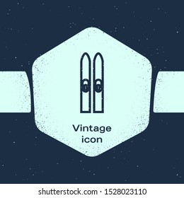 Grunge line Ski and sticks icon isolated on blue background. Extreme sport. Skiing equipment. Winter sports icon. Monochrome vintage drawing. Vector Illustration