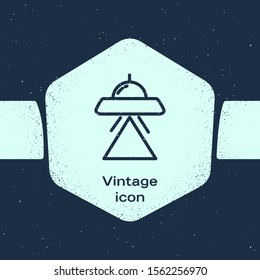 Grunge line UFO flying spaceship icon isolated on blue background. Flying saucer. Alien space ship. Futuristic unknown flying object. Monochrome vintage drawing. Vector Illustration