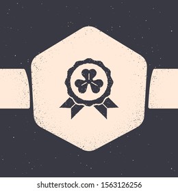Grunge Medal with four leaf clover icon isolated on grey background. Happy Saint Patrick day. Monochrome vintage drawing. Vector Illustration