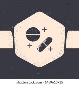 Grunge Medicine pill or tablet icon isolated on grey background. Capsule pill and drug sign. Pharmacy design. Monochrome vintage drawing. Vector Illustration