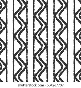 Grunge ornament. Lines and triangles. Drawing a rough brush. Seamless pattern.  Black, white.