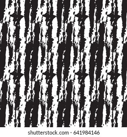grunge pattern in black and white on colorful hand painted background. Bold print with stripes and shapes on paint splatters and splashes. Vintage texture with ethnic and tribal motifs