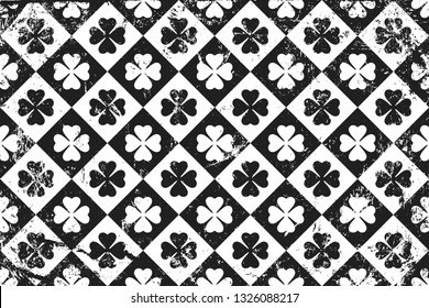 Grunge pattern with icon of clover. Horizontal black and white background.