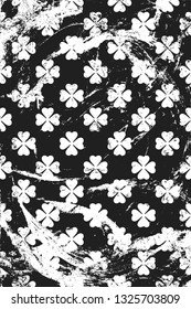 Grunge pattern with icon of clover. Vertical black and white background.
