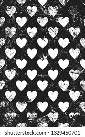 Grunge pattern with icons of hearts. Vertical 
black and white backdrop.