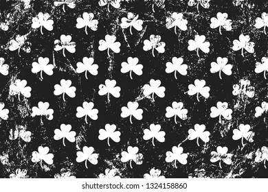 Grunge pattern with shamrock. Horizontal black and white background.