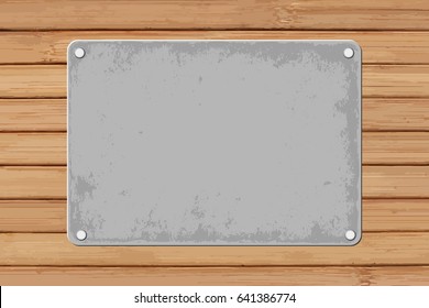 grunge plaque on wooden background
r