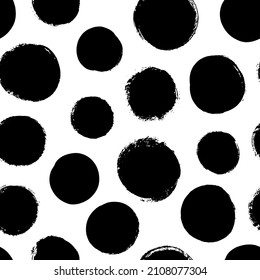 Grunge polka dot seamless vector pattern. Hand drawn black circle brushstrokes and round shapes. Abstract ink geometric background. Smears, circles, dots and blobs. Abstract wallpaper design